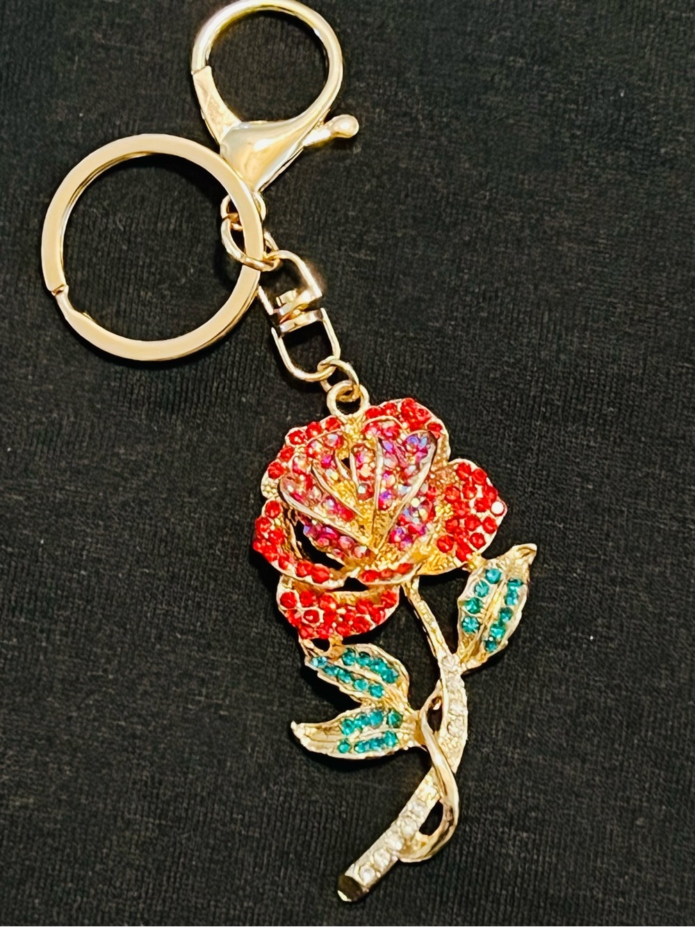 Gold-Tone Rose Bag Charm with Red Crystal Petals and Teal Leaves.       NWT